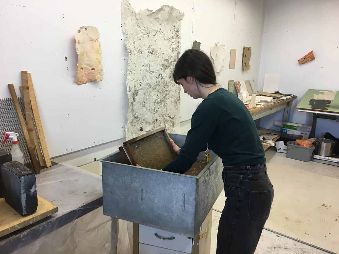 Exchange student Jasmine Pajdak works on pieces for her upcoming exhibition.