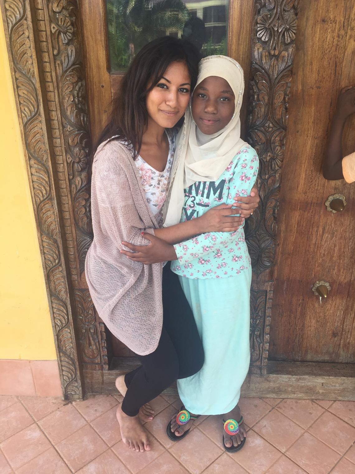 Dhalla with a young girl in Zanzibar where she runs the Daraja Foundation.