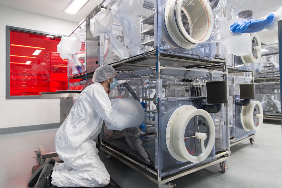 A researcher prepares the isolator in the Axenic Breeding room at the International Microbiome Centre's germ-free facility at the University of Calgary. Photo by Don Molyneaux 