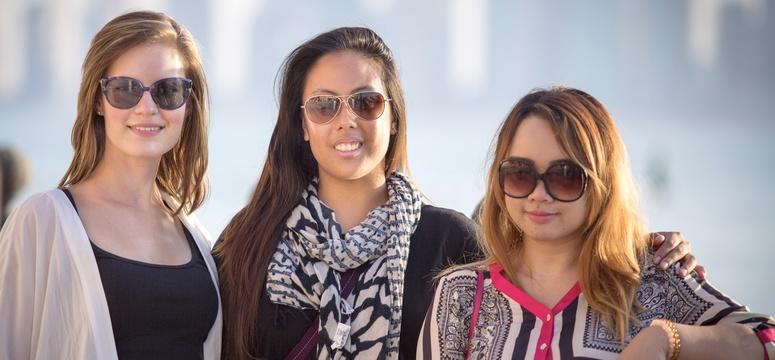 University of Calgary in Qatar nursing student Stephany Tapa, right, will graduate alongside Catherine Godzwon and Mia Torres from the University of Calgary's Faculty of Nursing on June 11.