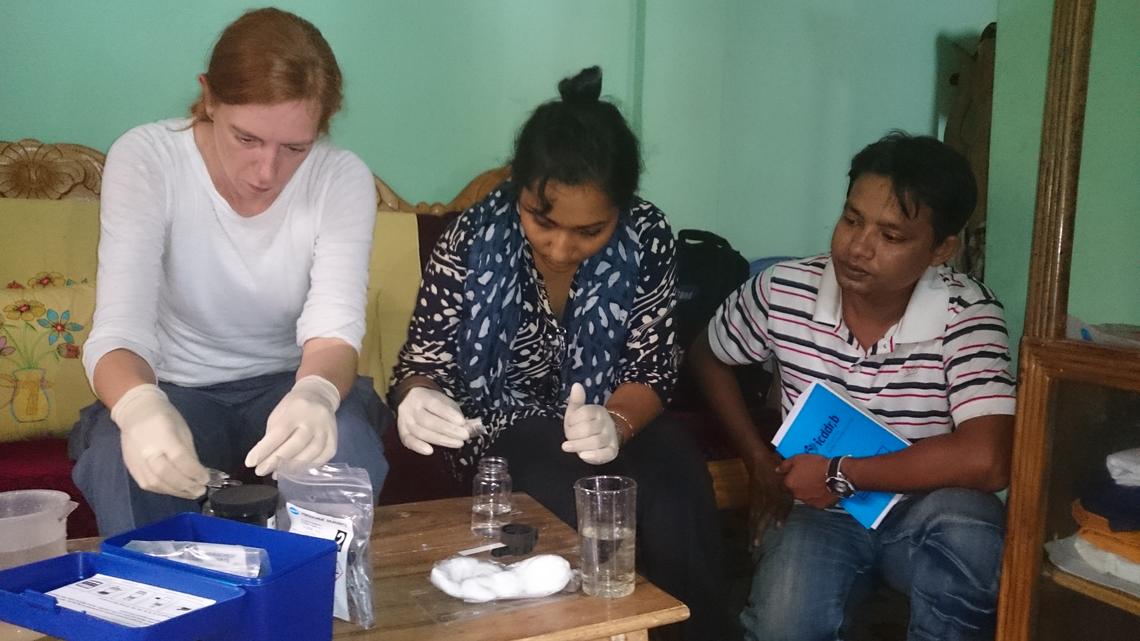 Regina Krohn, left, tests water samples in a Bangladesh village. Between 2000 and 2010, 77 million Bangladeshis were exposed to arsenic from contaminated well water. Arsenic poisoning can lead to cancer, skin lesions, lung problems, hypertension, diabetes, cardiovascular and central nervous system disorders.