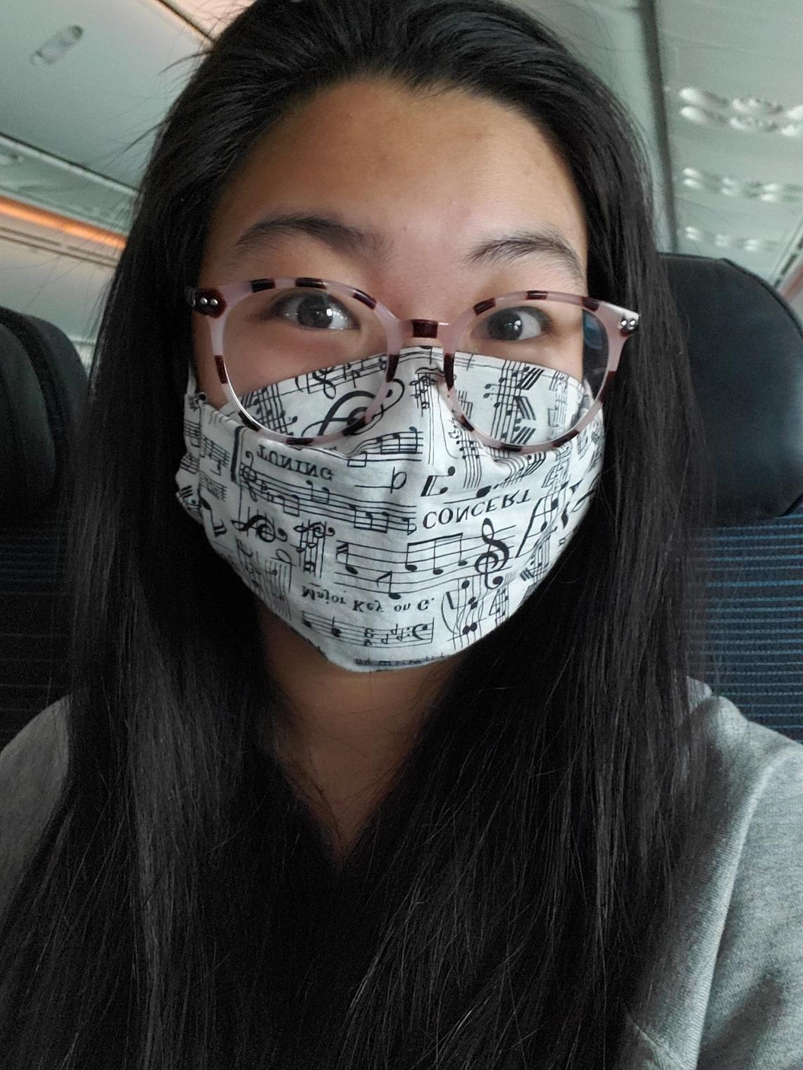 Cheung wearing a music-themed pandemic mask during February this year, the month she spent three weeks in a quarantine hotel in Hong Kong. The photo was taken on one of her flights. 