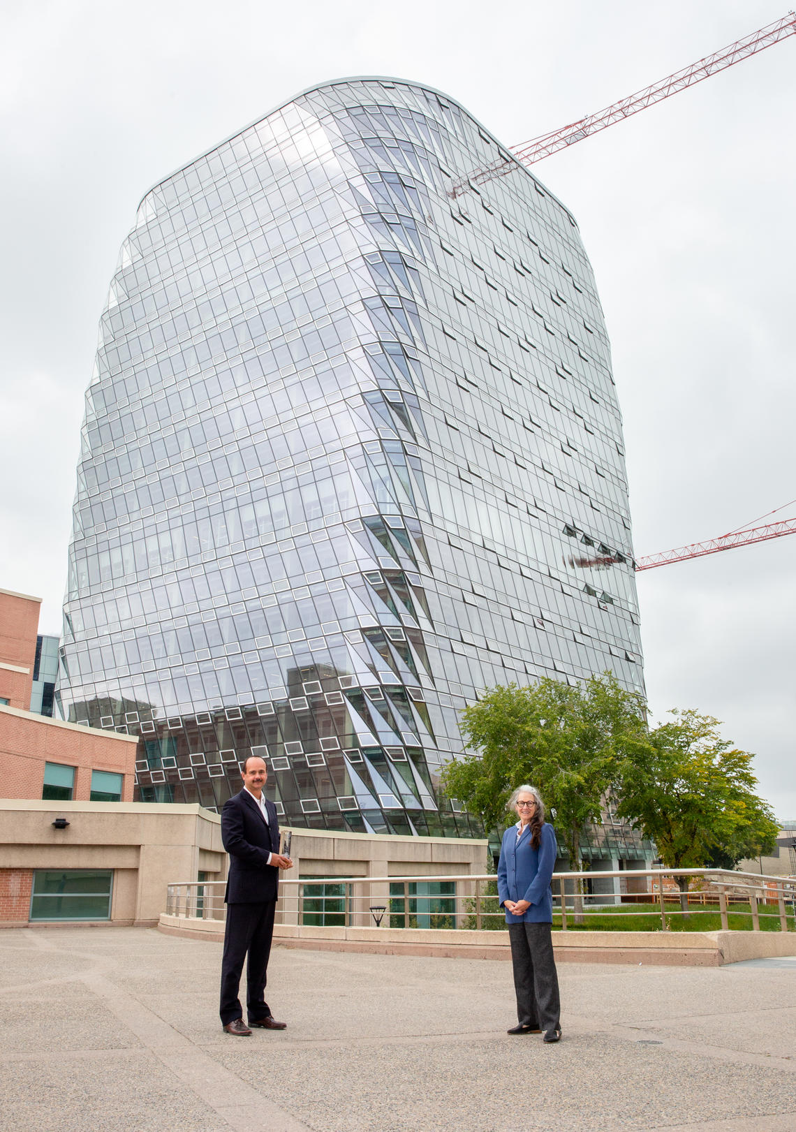 Joanne Perdue, AVP, Sustainability, and Boris Dragicevic, AVP, Facilities Development, hold the Zero Carbon Green Building Excellence Award for the MacKimmie Tower and its sustainability features.