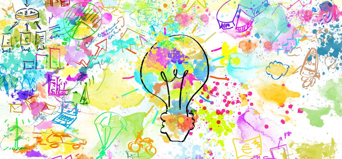 A colourful drawing with business sketches and splashes of bright colours with a lightbulb in the centre.