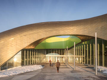 The undulating copper-tiled roof at the Shane Homes YMCA at Rocky Ridge was conceived by GEC Architecture.