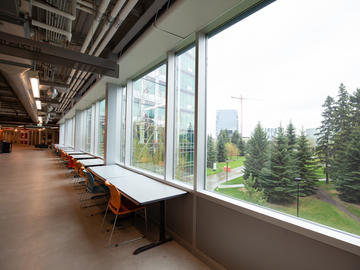 Vacant study spaces overlook an empty campus.