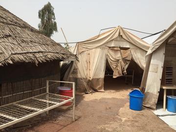 A tukul (mud hut) on the COVID unit at the UN encampment where Baloch works with MSF. 