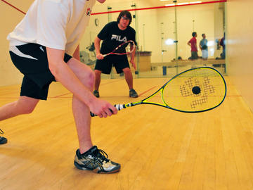 Students play squash.