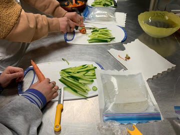 Students cutting up ingredients