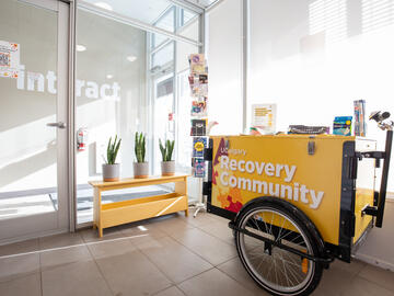 Interior of the UCalgary Recovery Community Hub showing a coffee cart