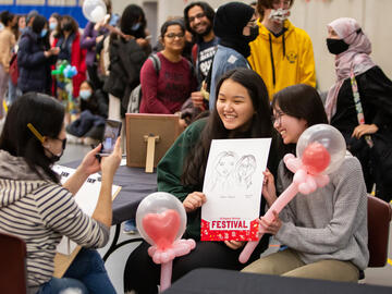 UCalgaryStrong Caricature artist drawing students