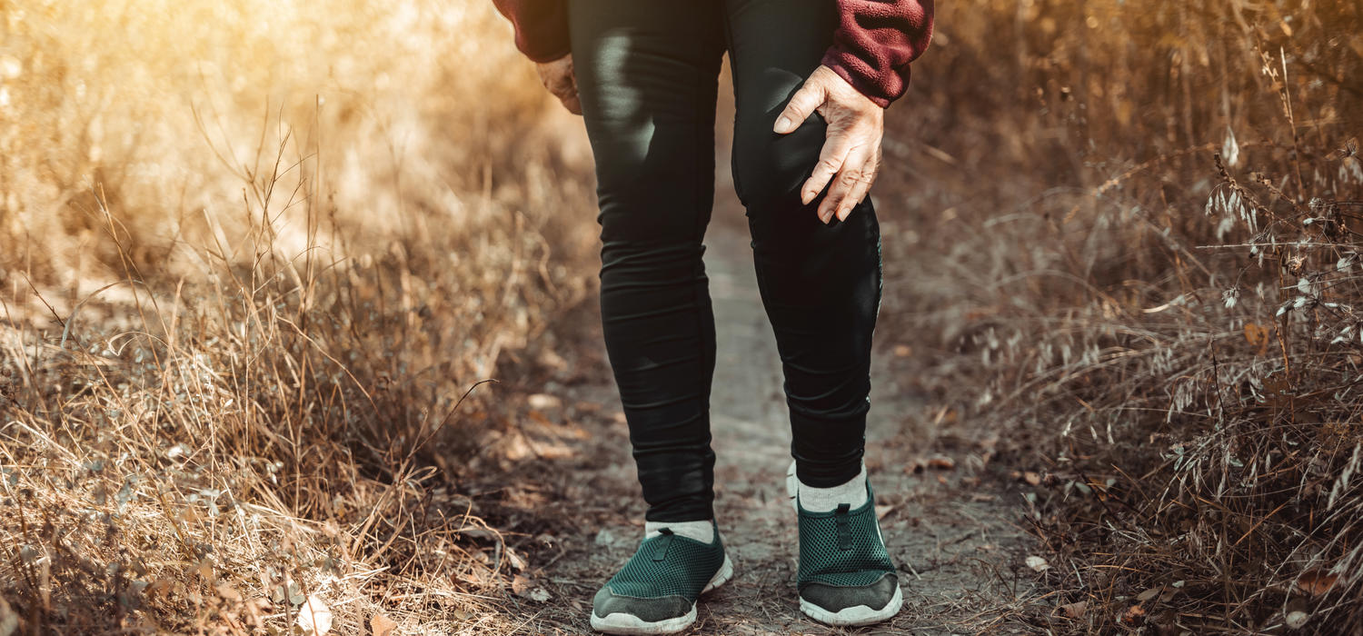 Image of a person walking with a sore knee