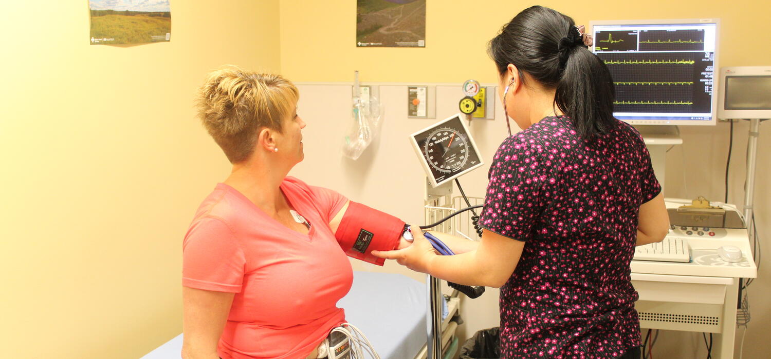 A healthcare provider works with a congenital heart patient
