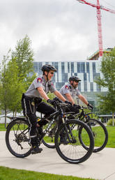 More than 80 per cent of Campus Security Survey respondents reported feeling either generally safe or very safe at the University of Calgary. Campus Security's Tesha Lingren, left, and Jean Beaudoin on bike patrol. Photo by Riley Brandt, University of Calgary 