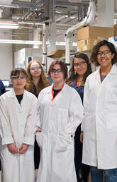 Grade 8 girls joined Ranjani Kannaiyan, second from left, in the lab as part of their day on the University of Calgary campus participating in Operation Minerva. Photo by Riley Brandt, University of Calgary 