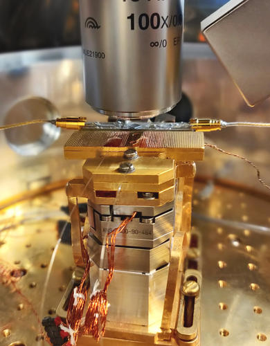 The innermost part of a quantum transduction experimental setup that has a diamond chip at its core.
